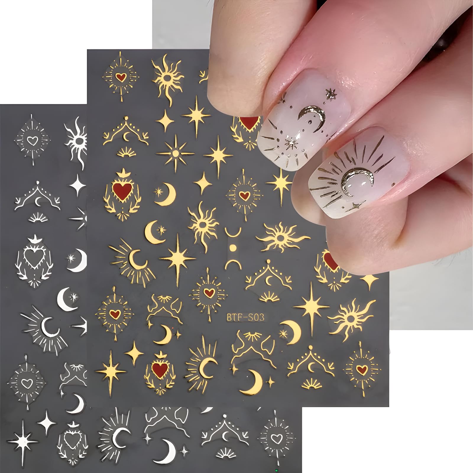 Close up of gold and silver sun moon heart nail decals