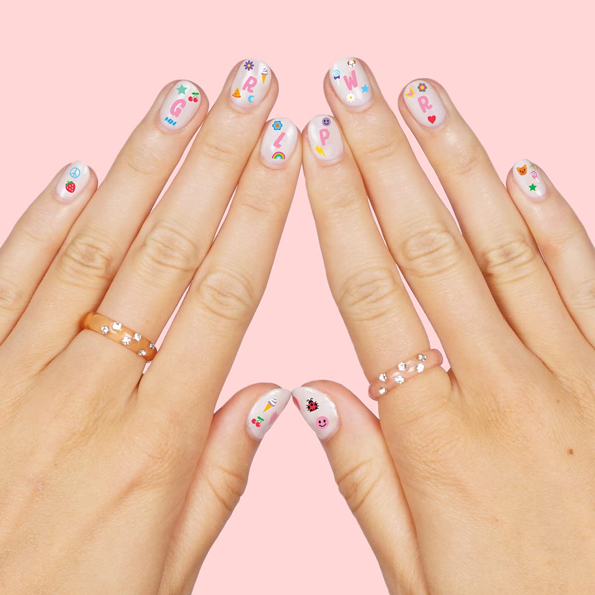 Girl applying Xo, Fetti nail stickers during a DIY party activity