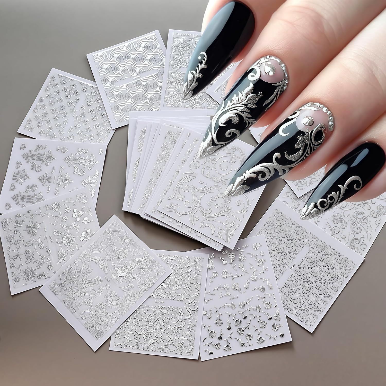 Close up of silver floral vine nail decals