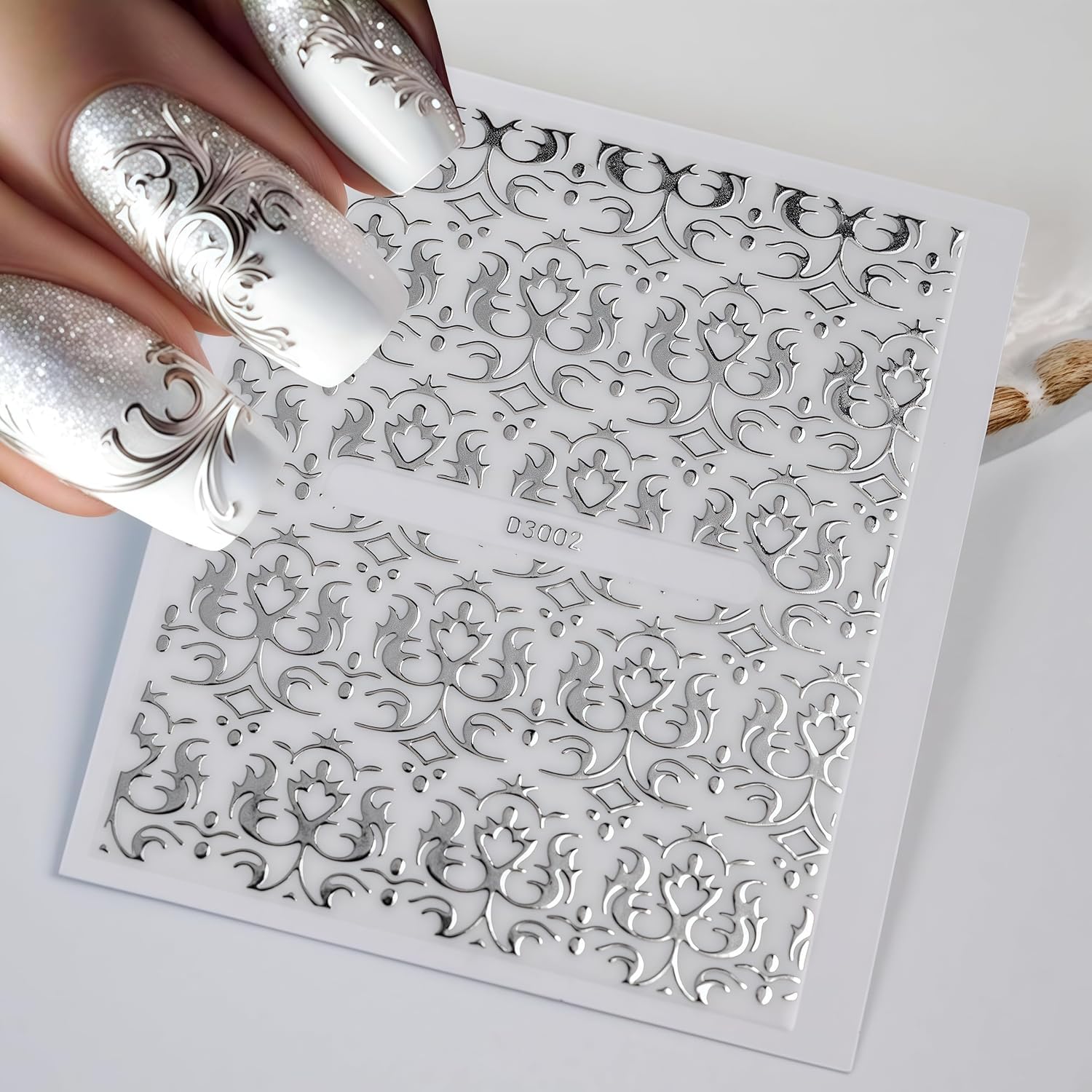 Thirty sheets of assorted silver nail art designs