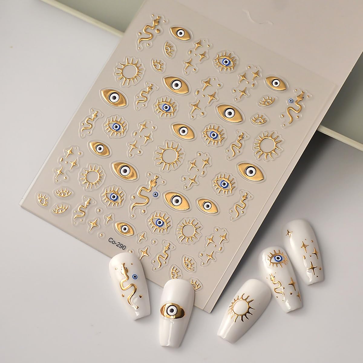 Close up of 3D gold star and snake nail decals