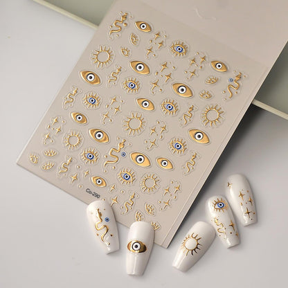 Close up of 3D gold star and snake nail decals