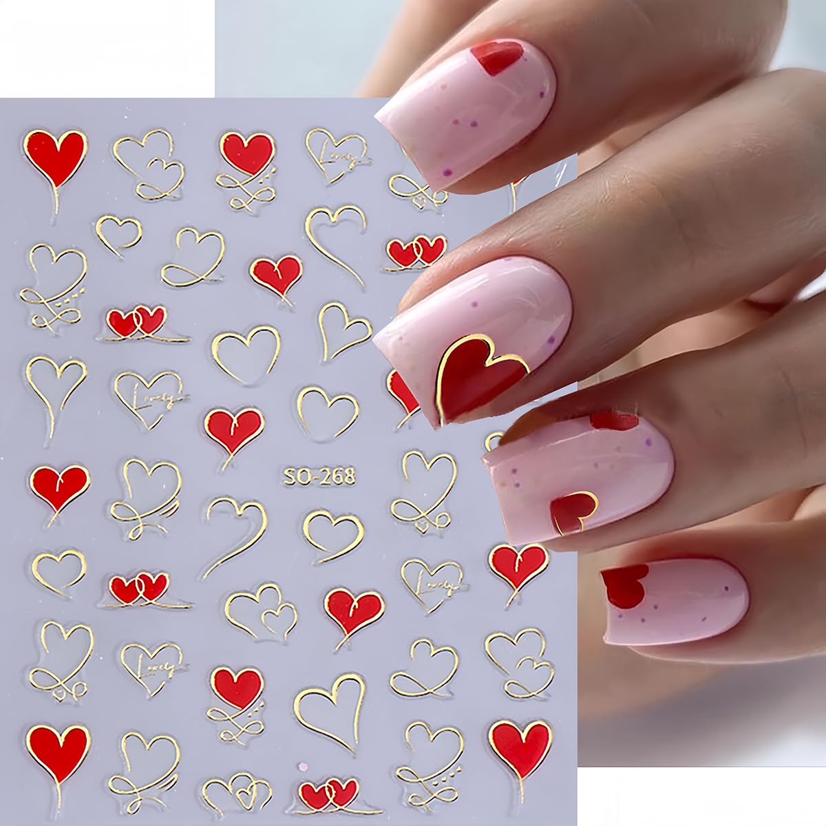 Hands displaying DIY manicure with heart nail art stickers