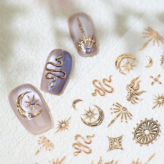 Close up of gold snake and moon nail art decals