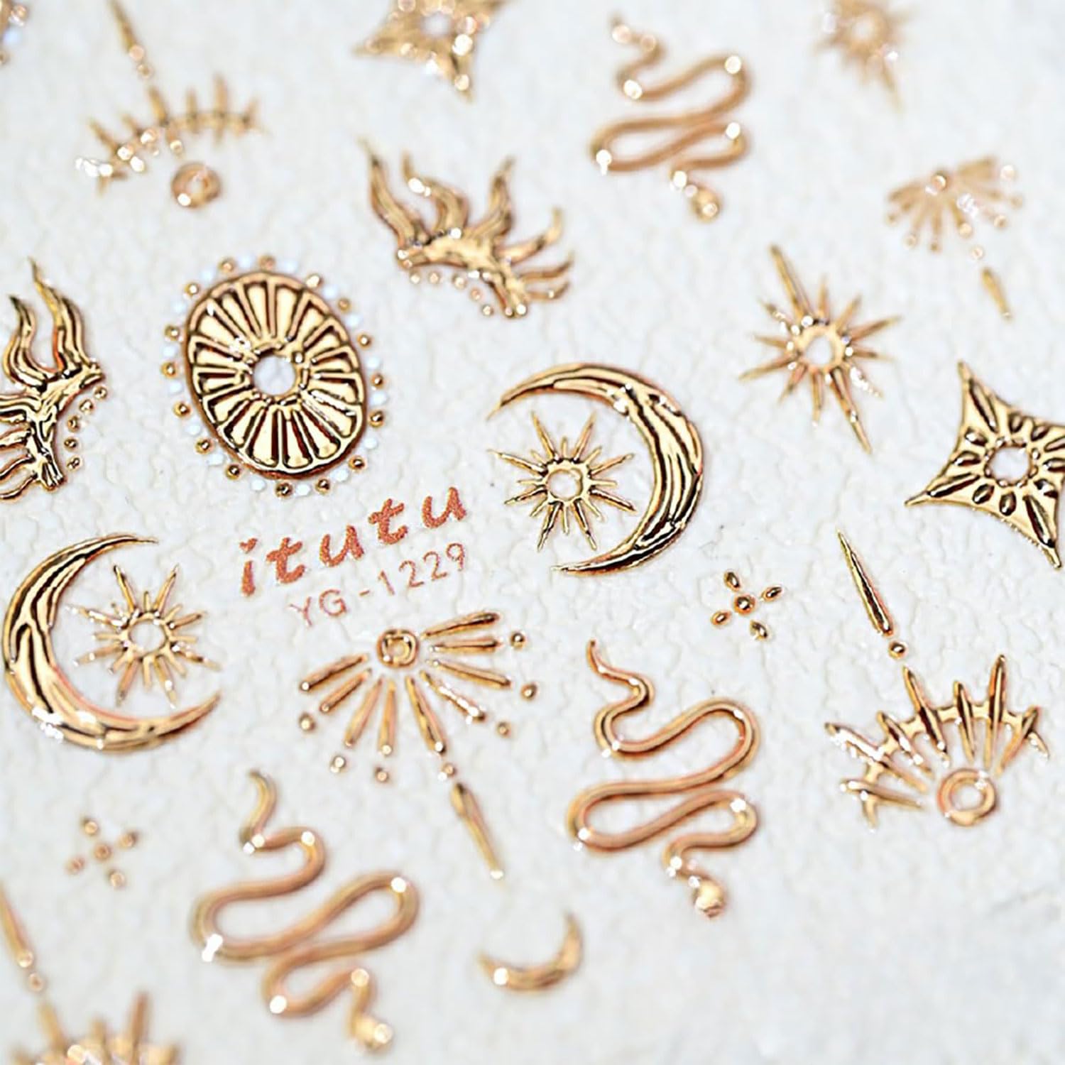 5D textured gold star nail stickers on a manicure