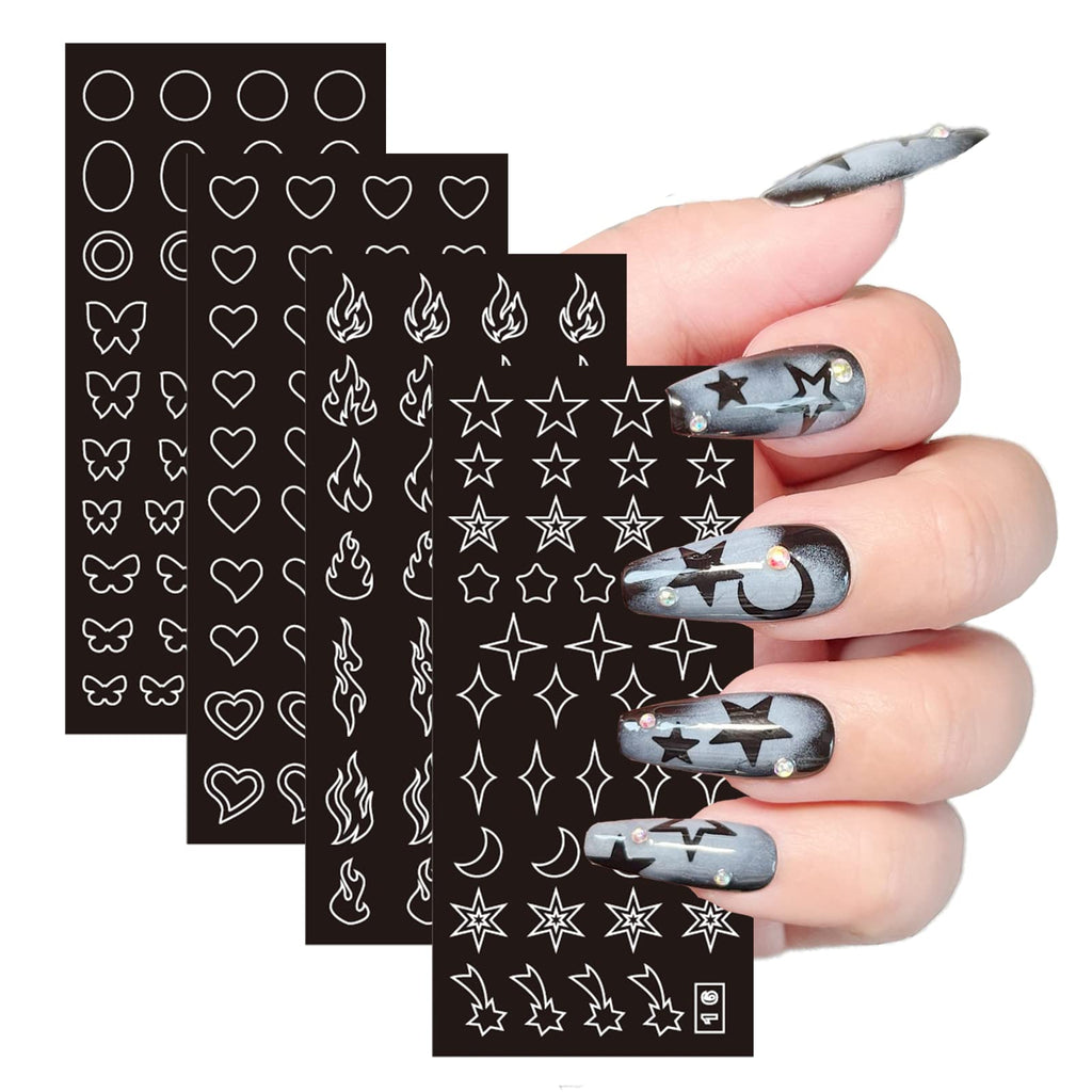 Close-up of hollow star and heart nail art templates