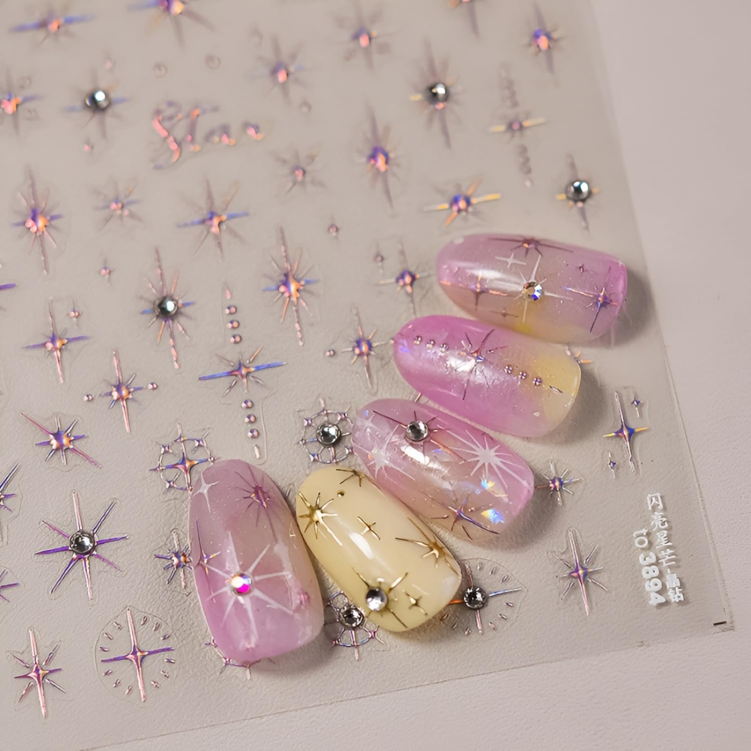 Three sheets of Namrec glitter star nail art stickers