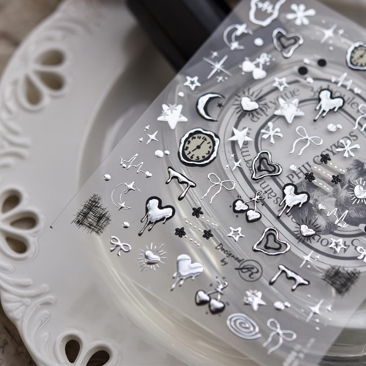 Close up of 5D embossed silver metal clock nail decals
