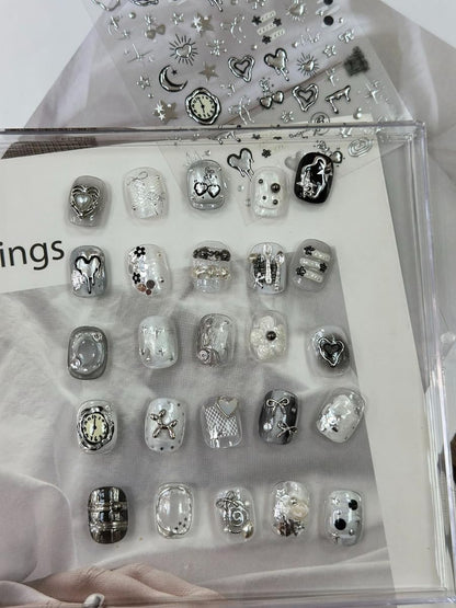 Self-adhesive silver heart and star nail charms sheet