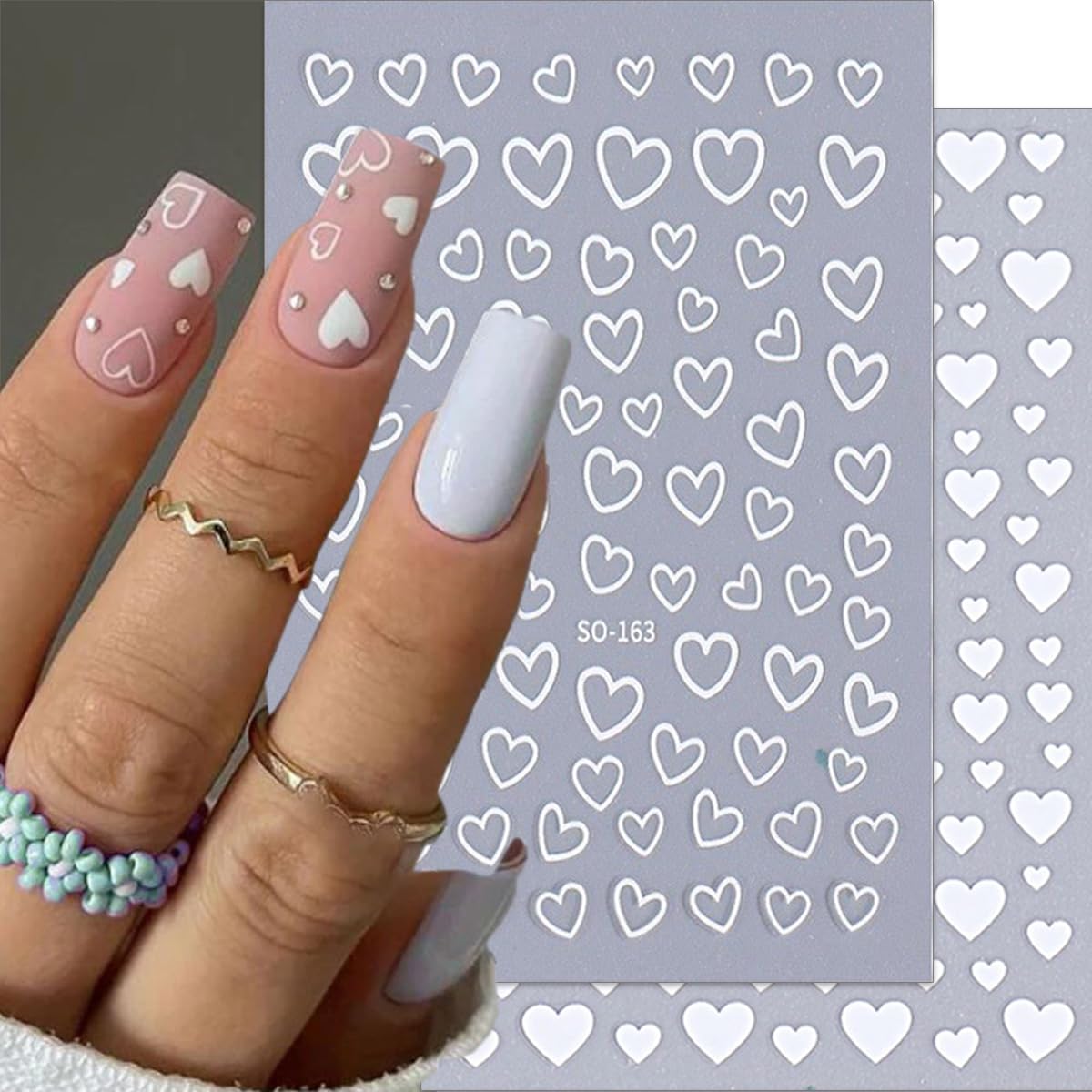 Close up of heart and star nail art decal designs