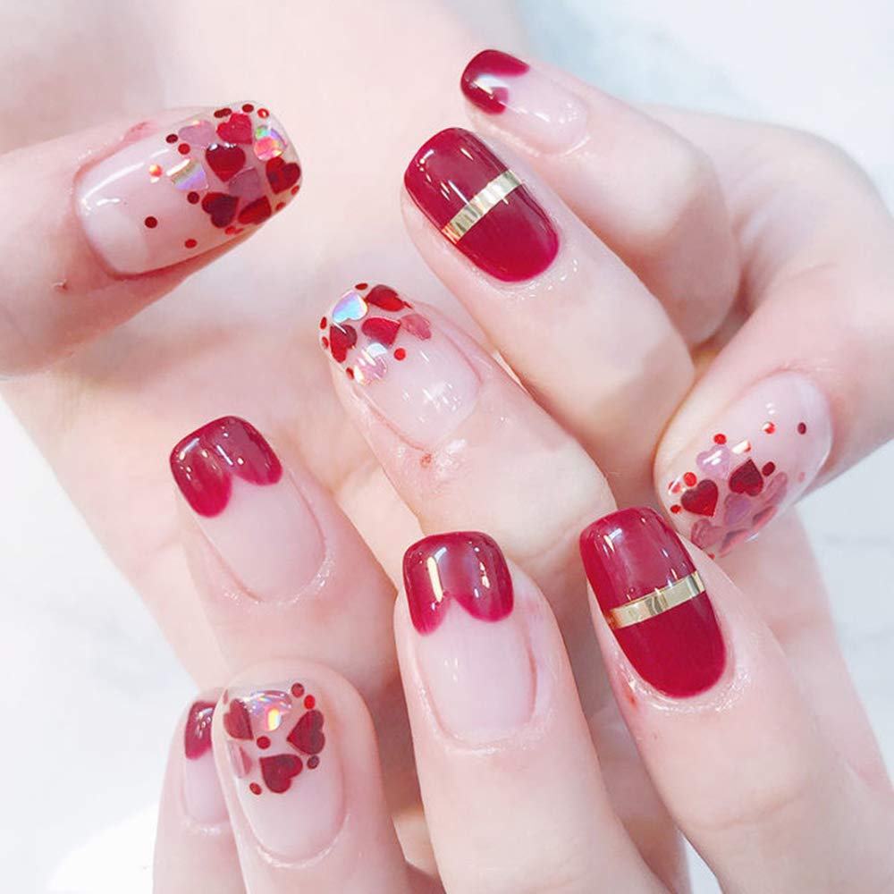 Model showing Valentine heart nail art design with SeBeauty sequins