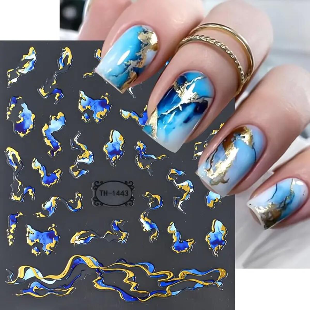Close up of blue and gold abstract geometric nail stickers