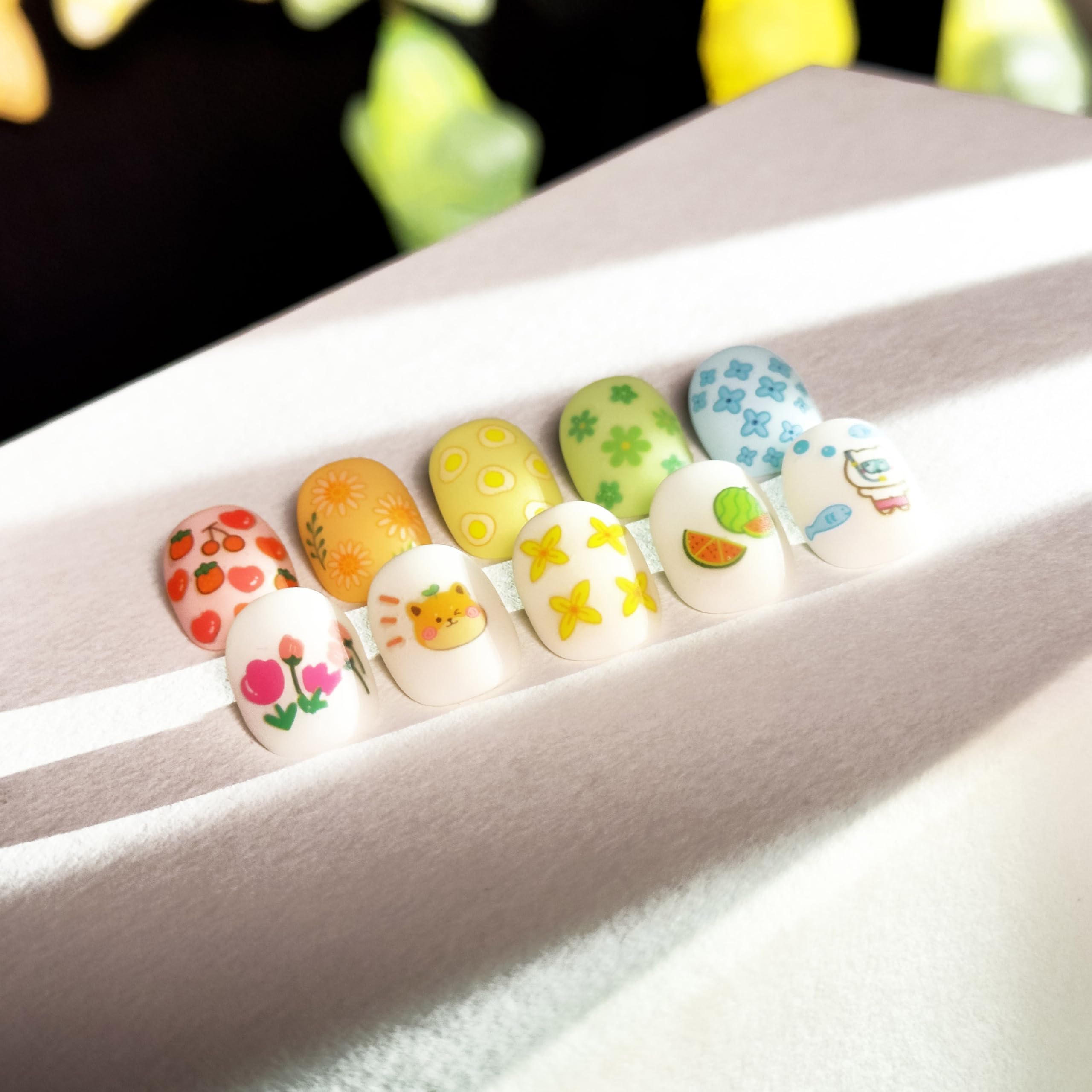 Variety of cute animal and floral nail decal designs on sheets