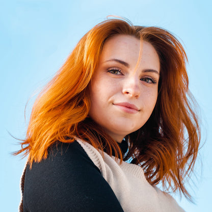 Side view of Overtone color depositing conditioner bottle detailing hair hydration benefits.