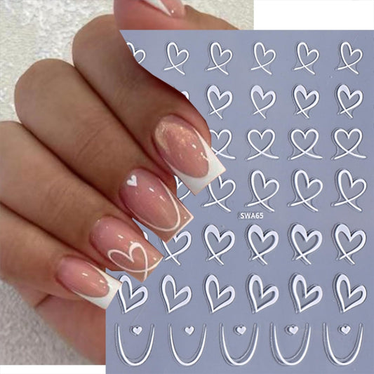 Close up of 3D black and white heart nail art decals