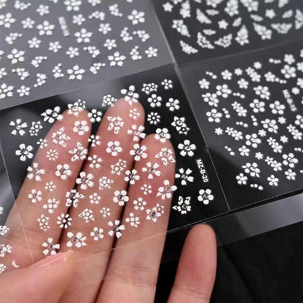 Example of self adhesive daisy nail art stickers applied to nails