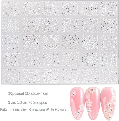 Professional manicure using 3D white flower stickers and rhinestones
