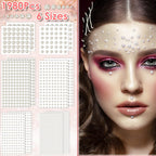 Close up of assorted size flatback faux pearls on sheet.