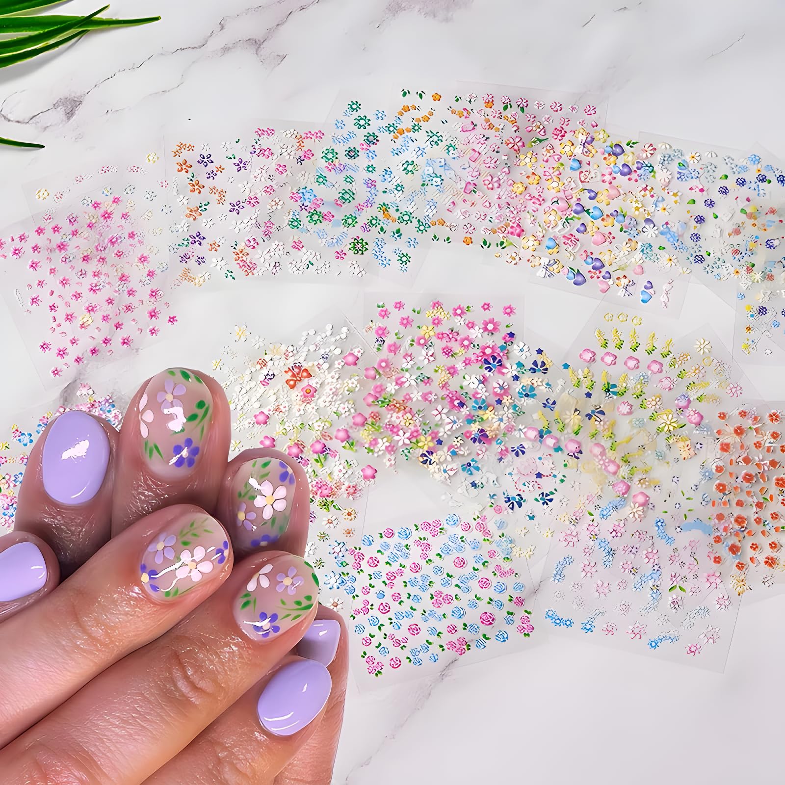 Close up view of 3D daisy and heart nail art decals