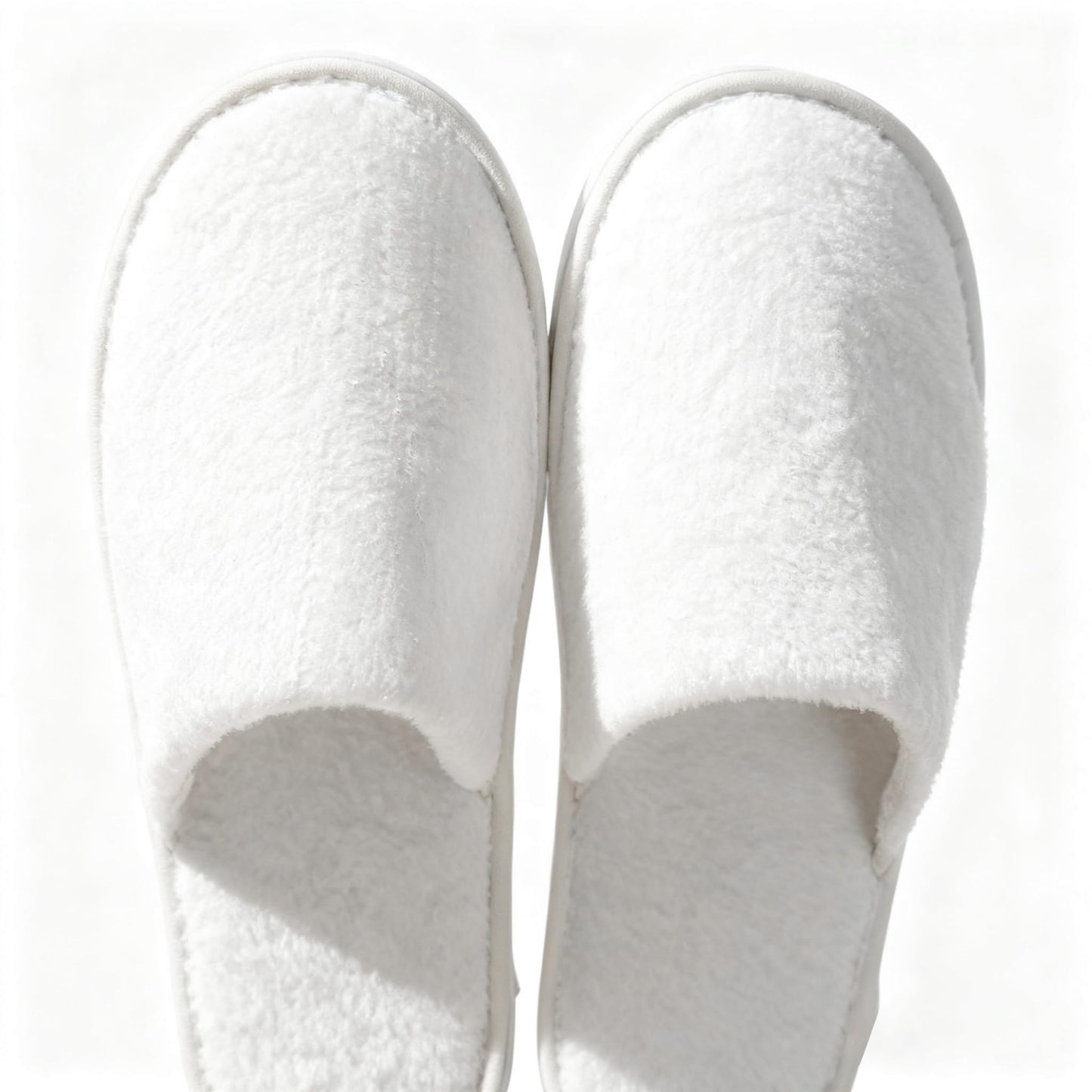 Man and woman wearing breathable disposable travel slippers