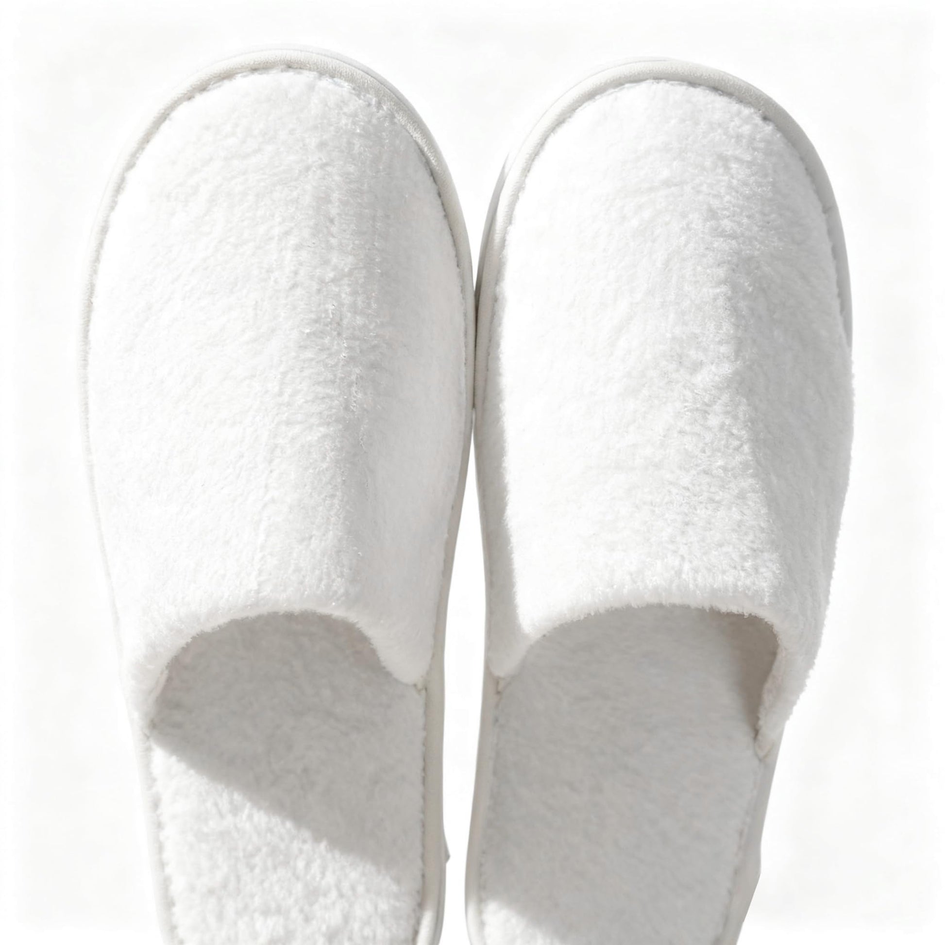 Man and woman wearing breathable disposable travel slippers