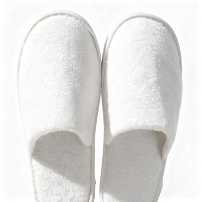 Man and woman wearing breathable disposable travel slippers