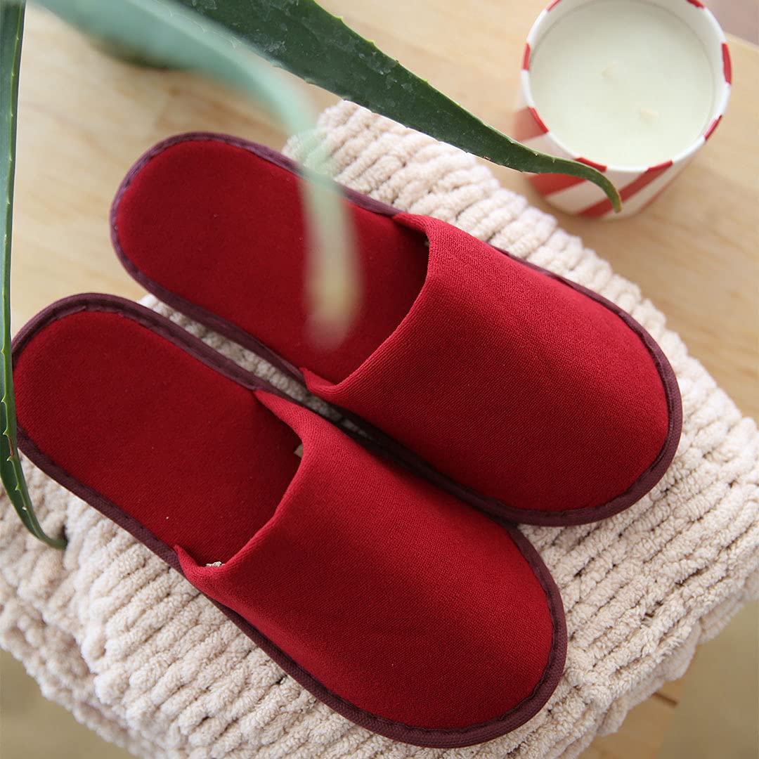 Ten pairs of individually wrapped non-woven unisex indoor slippers for spa and airbnb guests