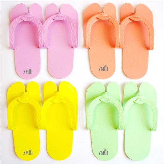 Assorted colors of non-slip single use salon sandals flat lay arrangement