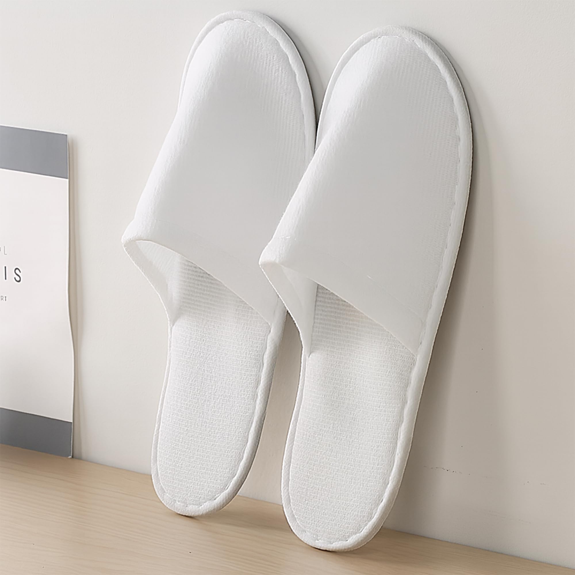 Soft fleece surface detail of Celmuron white guest slippers
