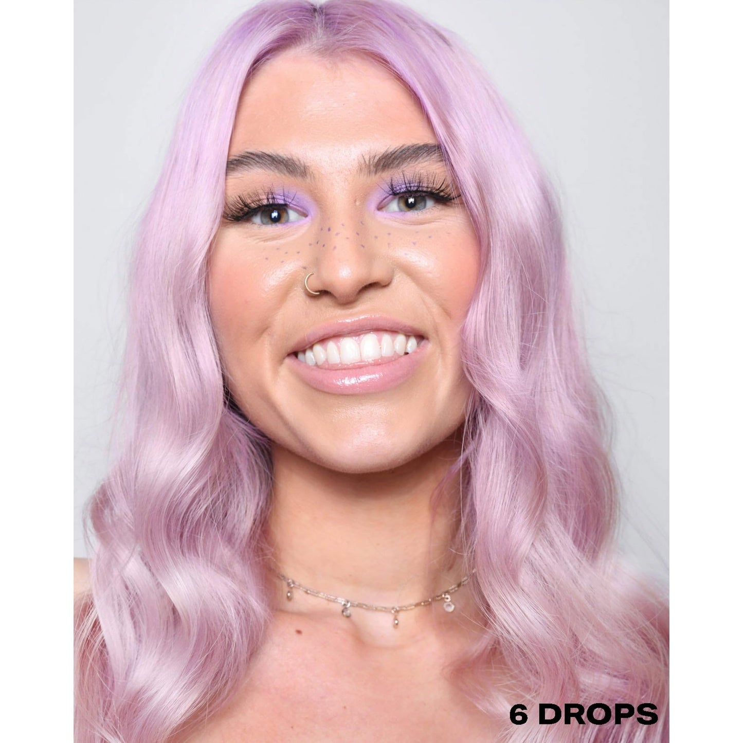 Model showing vibrant purple hair colored with Shrine drops