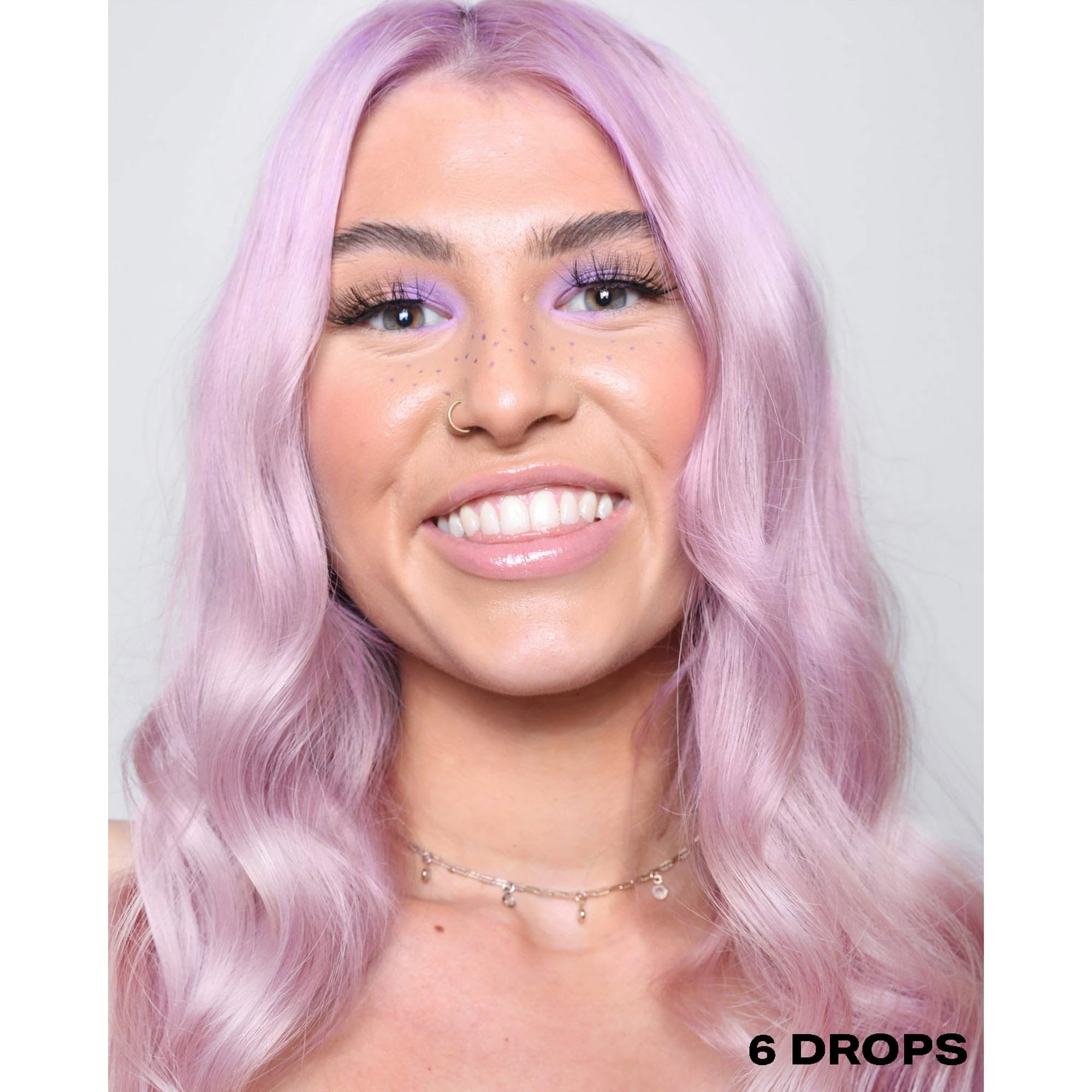 Model showing vibrant purple hair colored with Shrine drops