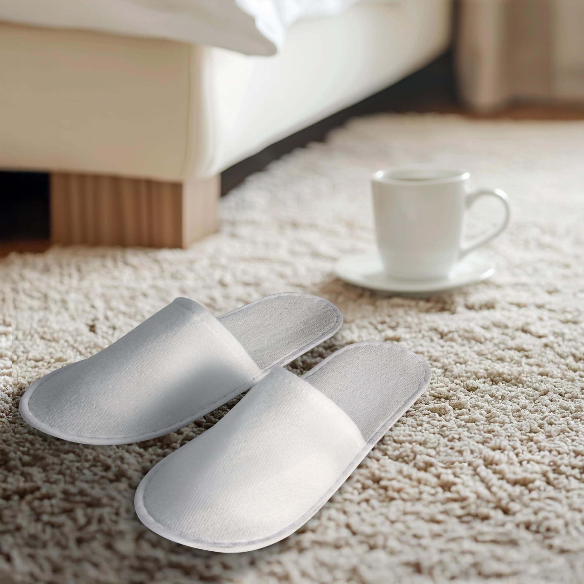 Bulk pack of white disposable spa slippers with storage pouch