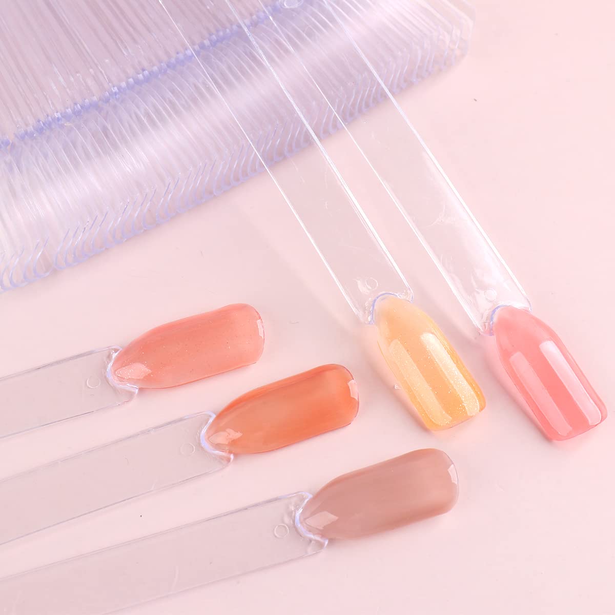 Professional nail art technician using swatch sticks to display gel polish