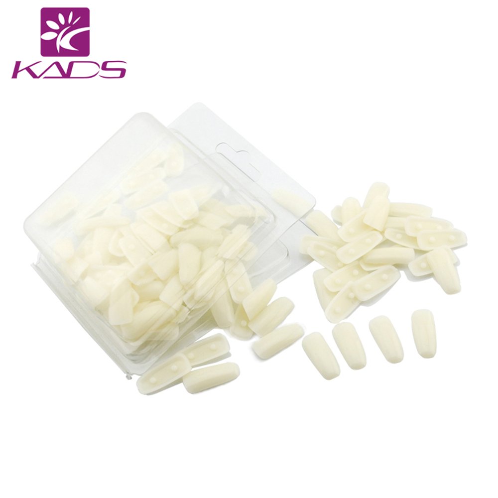 Close up of Kads nail practice stand holding nail tips