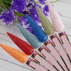 Close up of stiletto nail practice sticks for color swatching