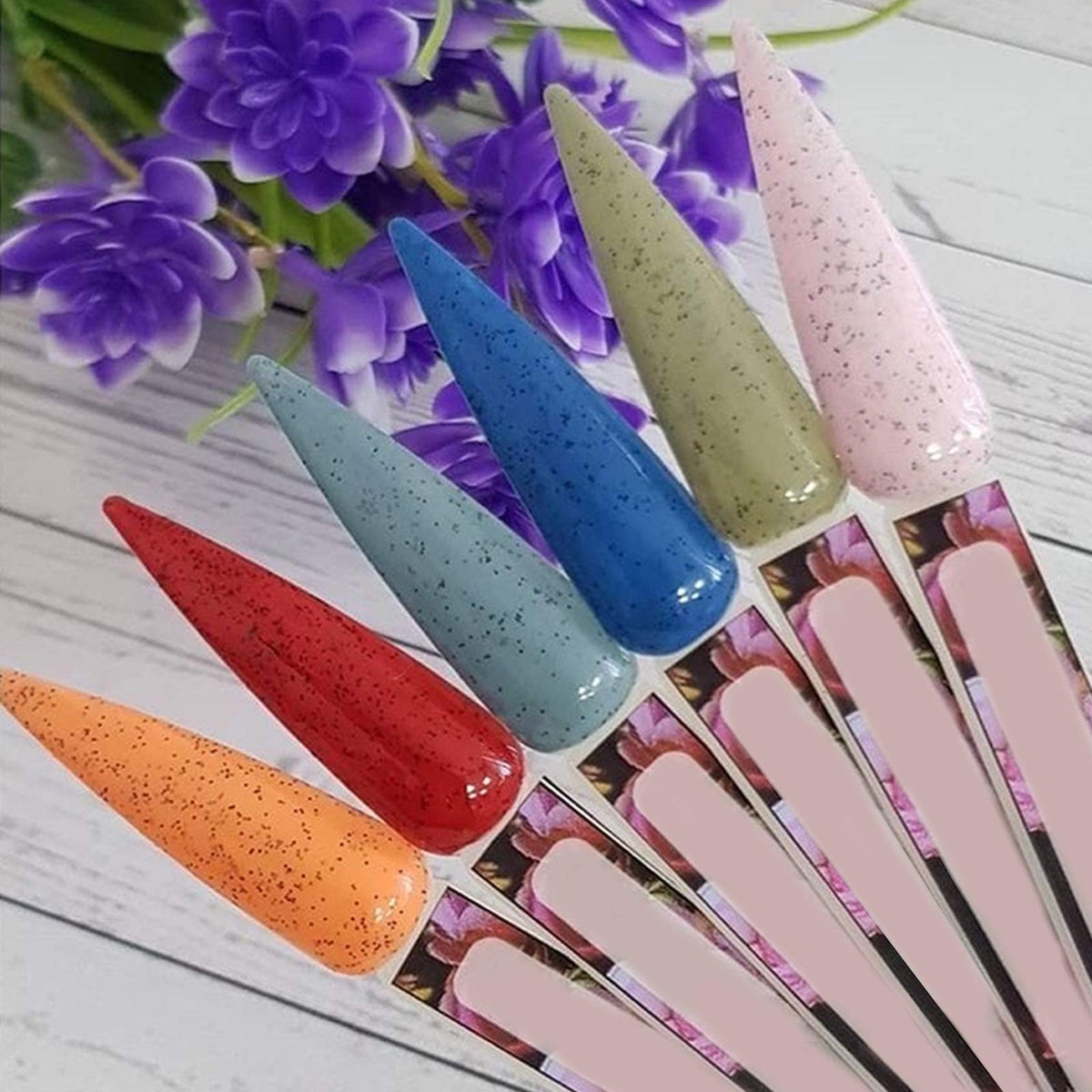 Close up of stiletto nail practice sticks for color swatching