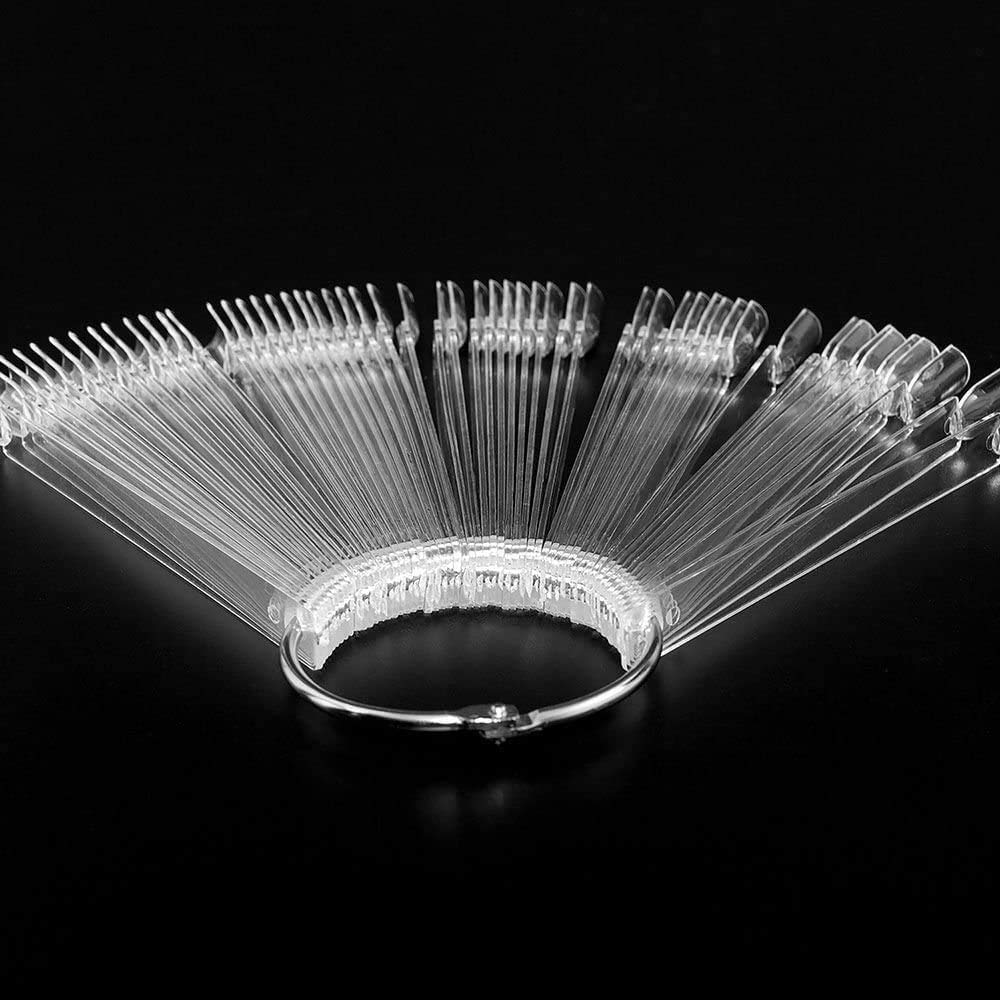 Professional nail technician using display sticks for gel polish