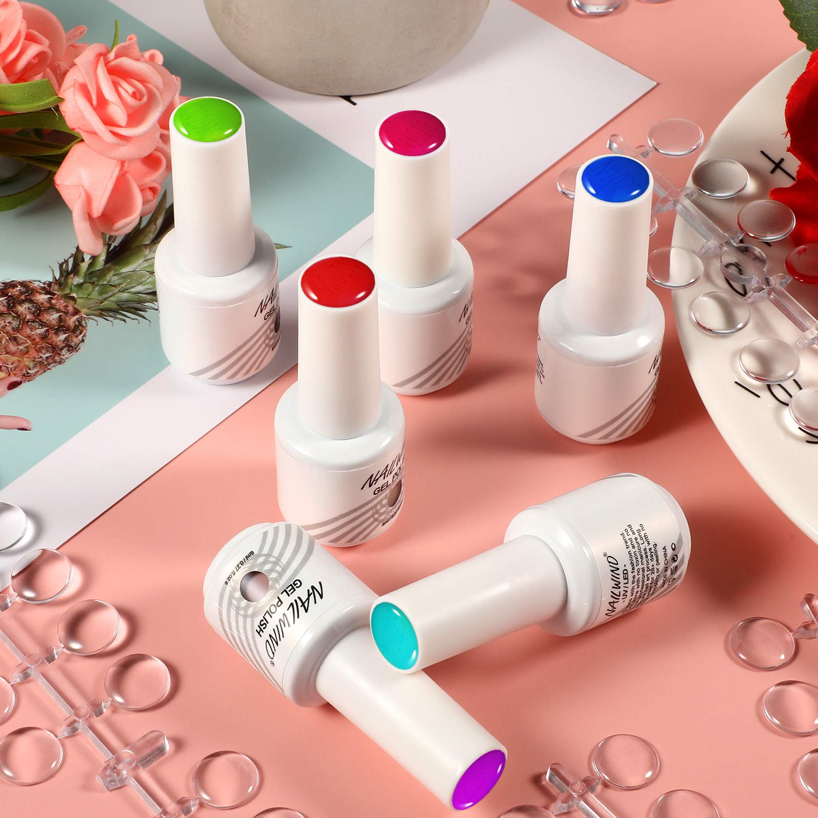 Transparent nail polish display tips attached to bottle caps