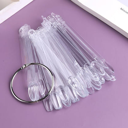 Nail technician using swatch sticks to demonstrate gel polish colors.