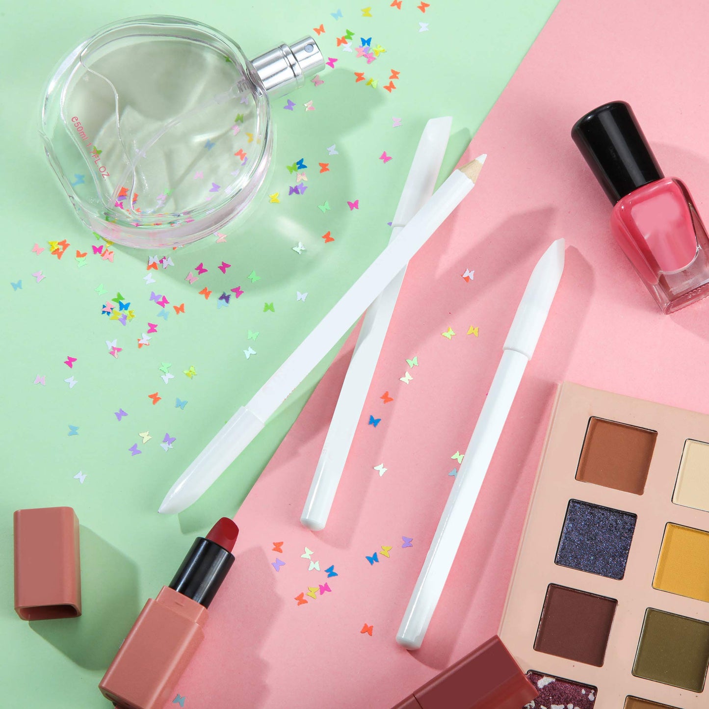 Ten pieces of white cosmetic pencils spread out to showcase the complete manicure supplies kit.