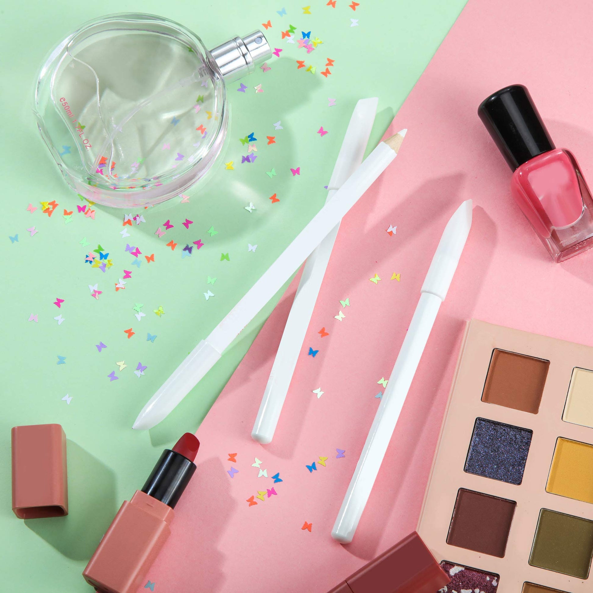 Ten pieces of white cosmetic pencils spread out to showcase the complete manicure supplies kit.