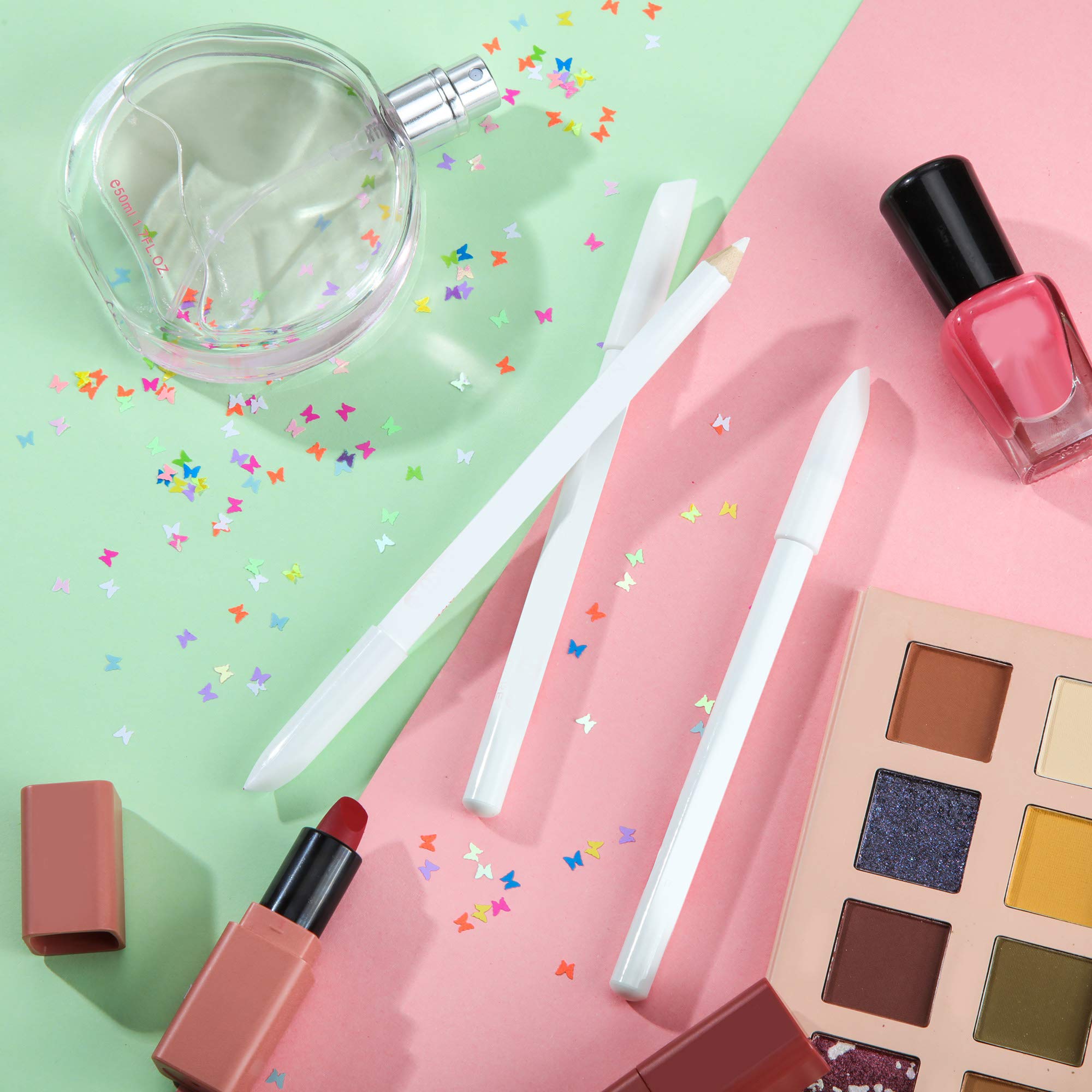 Ten pieces of white cosmetic pencils spread out to showcase the complete manicure supplies kit.