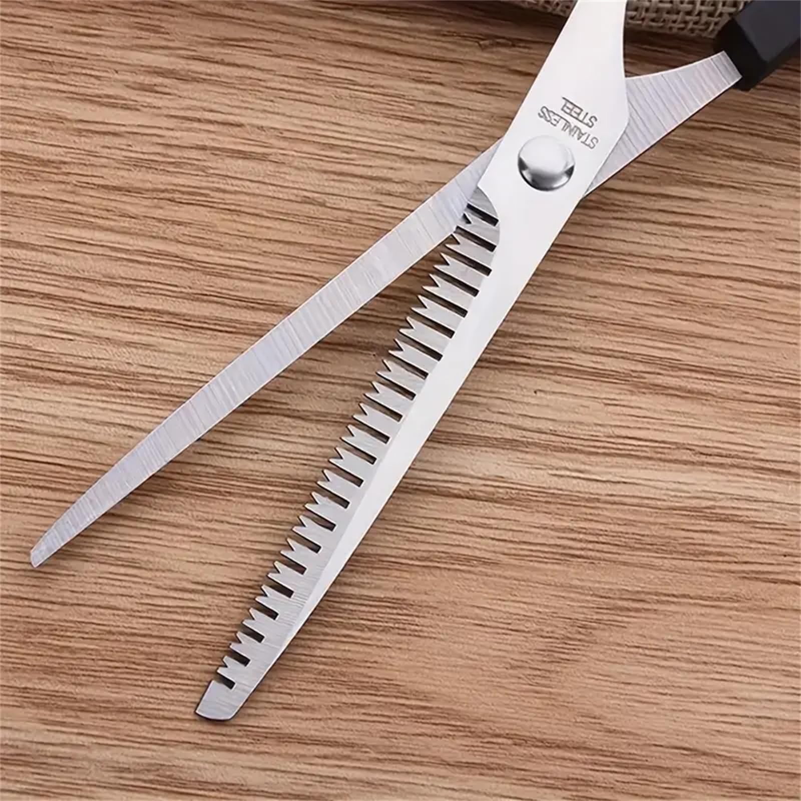 WOWITIS home salon shears set being adjusted for ergonomic hand comfort during professional styling