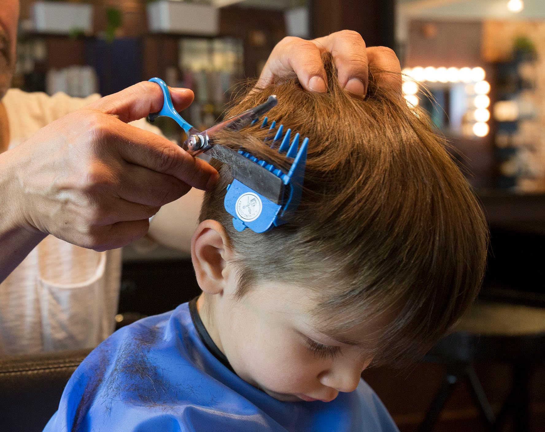 Haircut Hero achievement poster with gold star stickers for tracking children grooming milestones