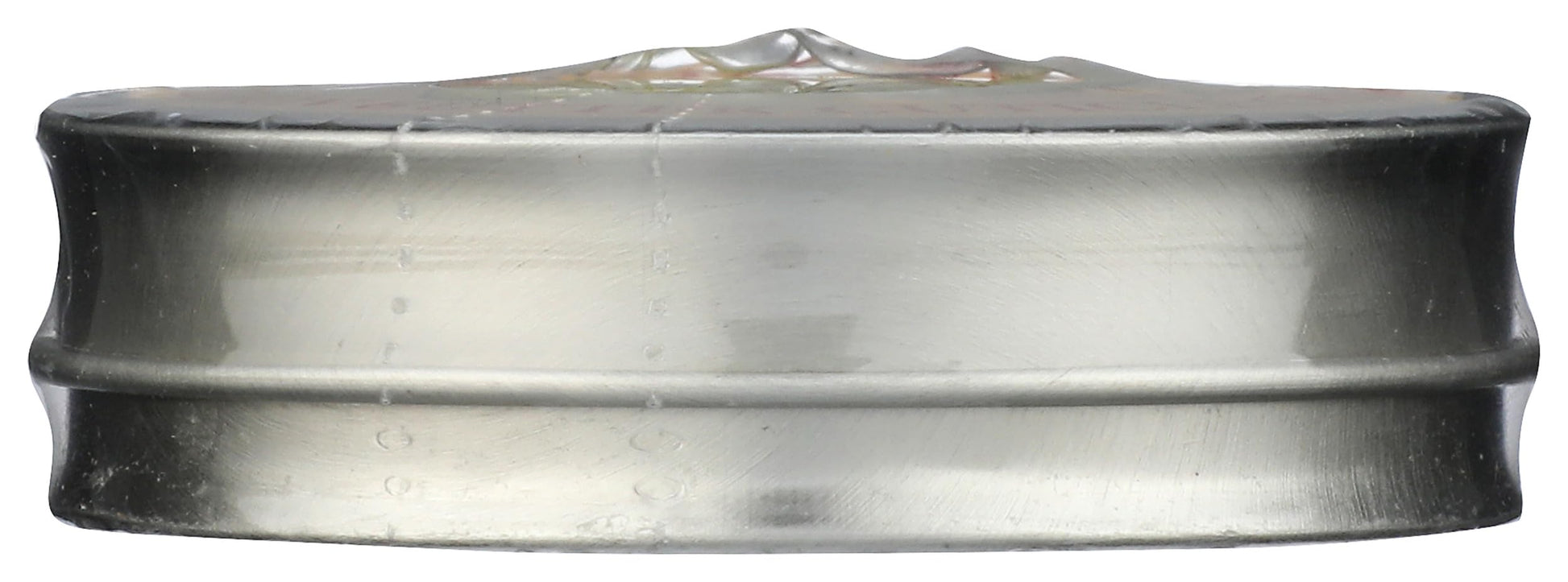 Close up shot of the lemon oil infused nail treatment tin placed next to fresh citrus ingredients for a clean beauty lifestyle view.