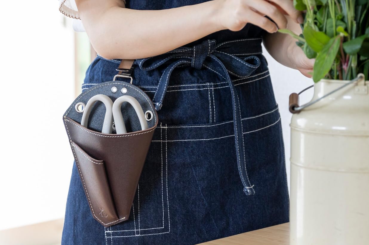 Japanese leather holster attached to a belt clip holding Sakagen floral shears