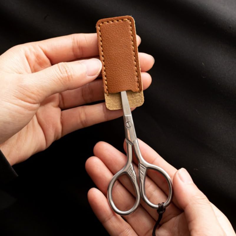 Durable sewing scissor storage bag cover protecting a sharp embroidery shear.