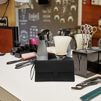 HONMEET leather hair tool case being held by a stylist to demonstrate travel portability.
