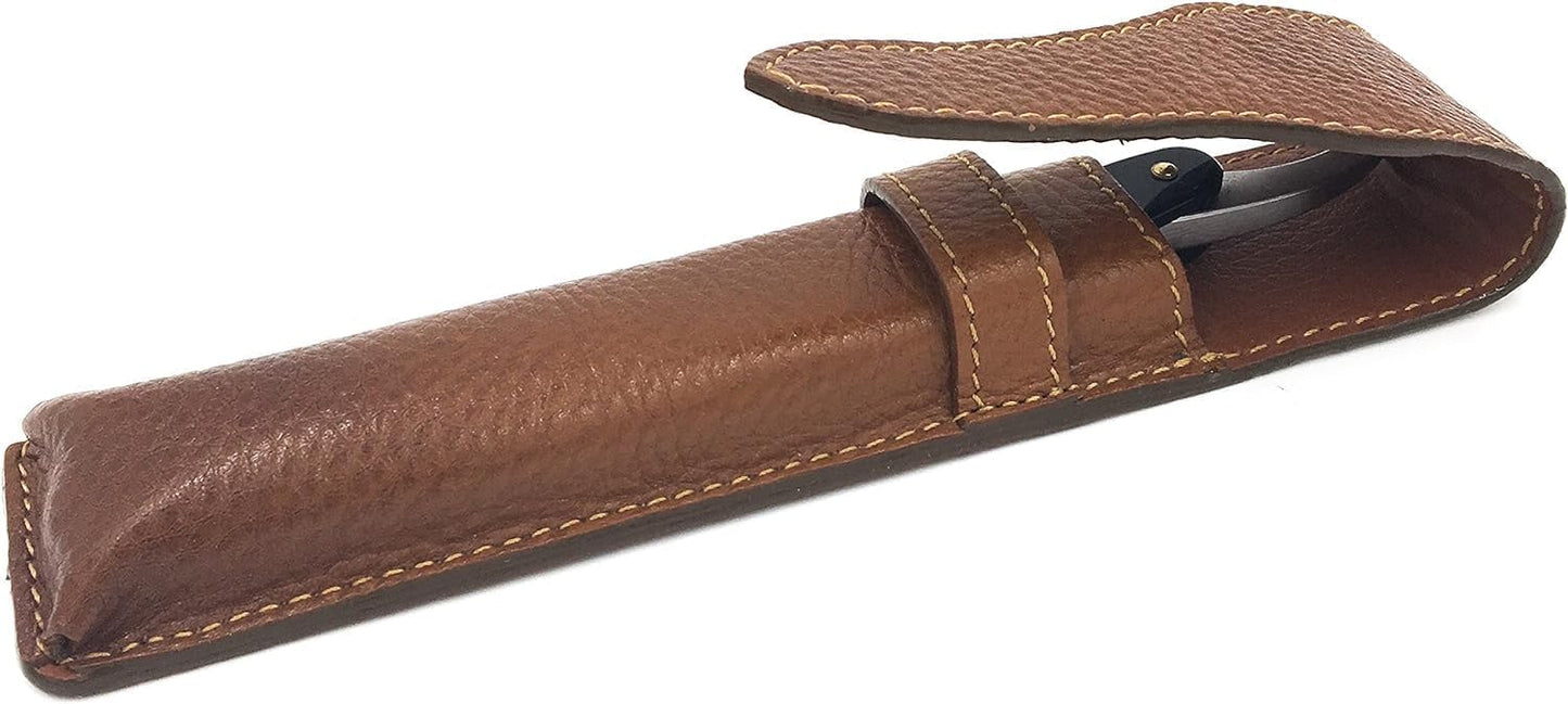 Saddle brown full grain leather travel sleeve for straight razors lying flat.