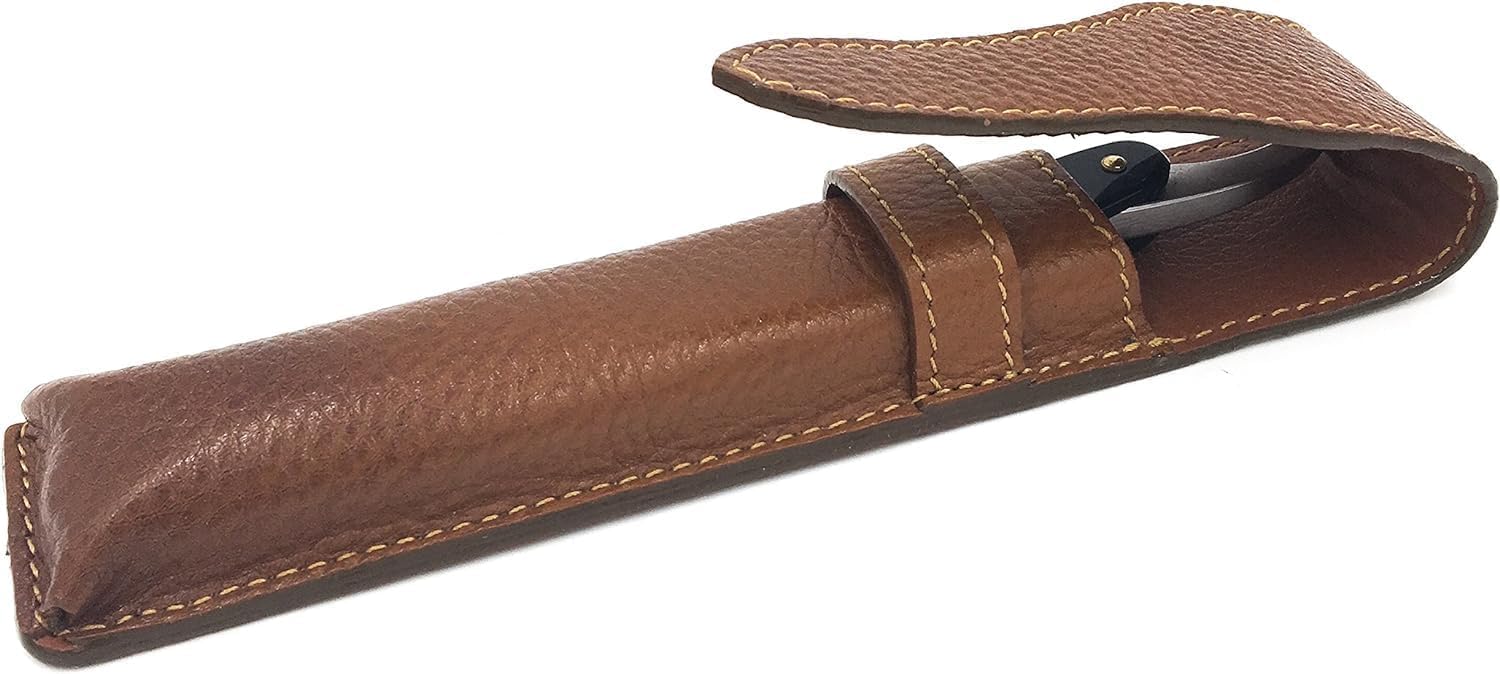 Saddle brown full grain leather travel sleeve for straight razors lying flat.